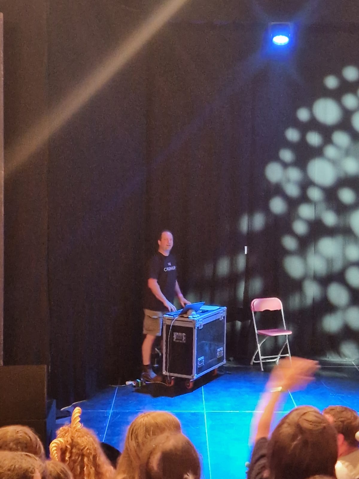 Stuart operating sound on stage in the theatre tent at Beautiful Days Festival